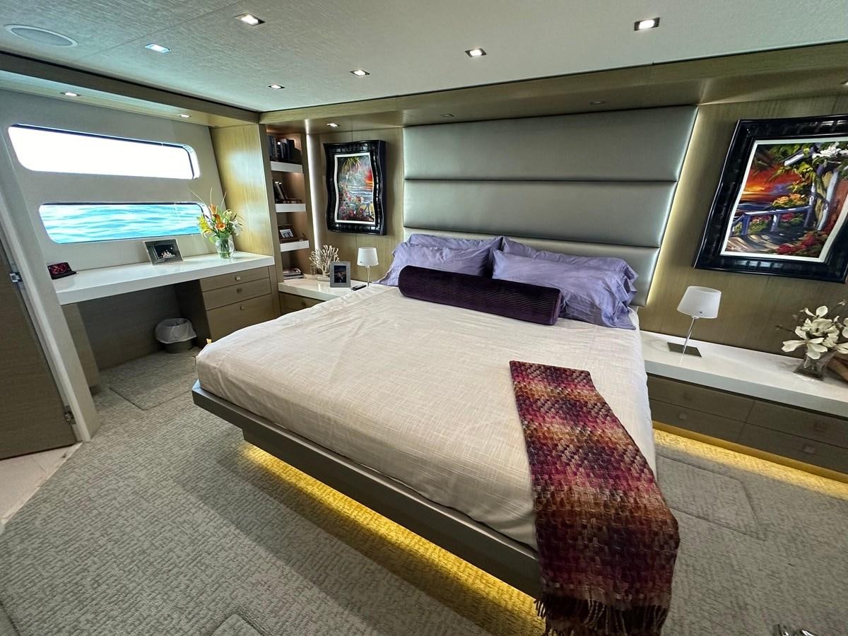 a bedroom with a bed aboard WATER RODEO Yacht for Sale