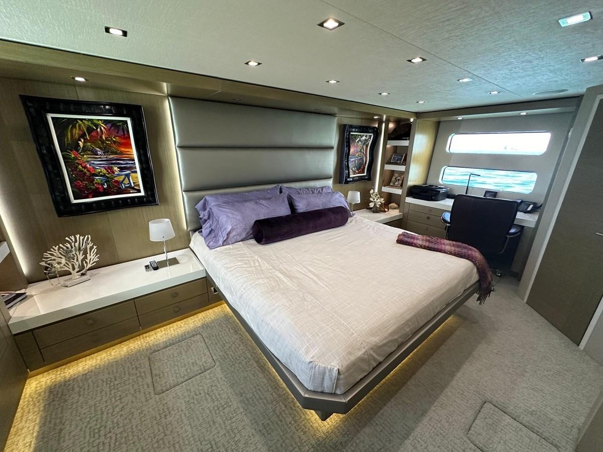 a bedroom with a large bed aboard WATER RODEO Yacht for Sale