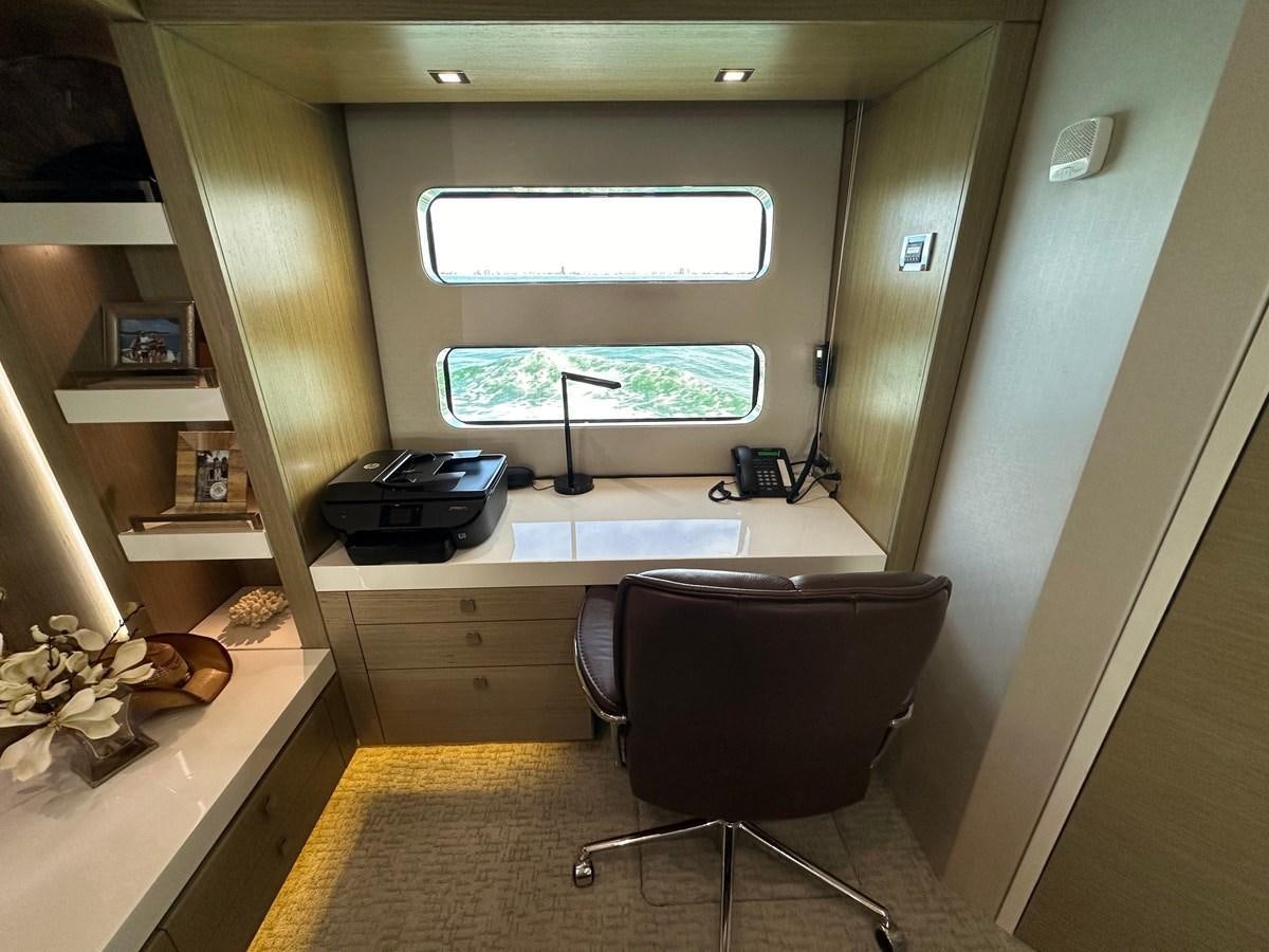 a room with a desk and a chair aboard WATER RODEO Yacht for Sale