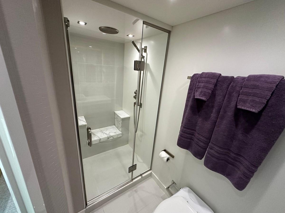 a bathroom with a large mirror aboard WATER RODEO Yacht for Sale