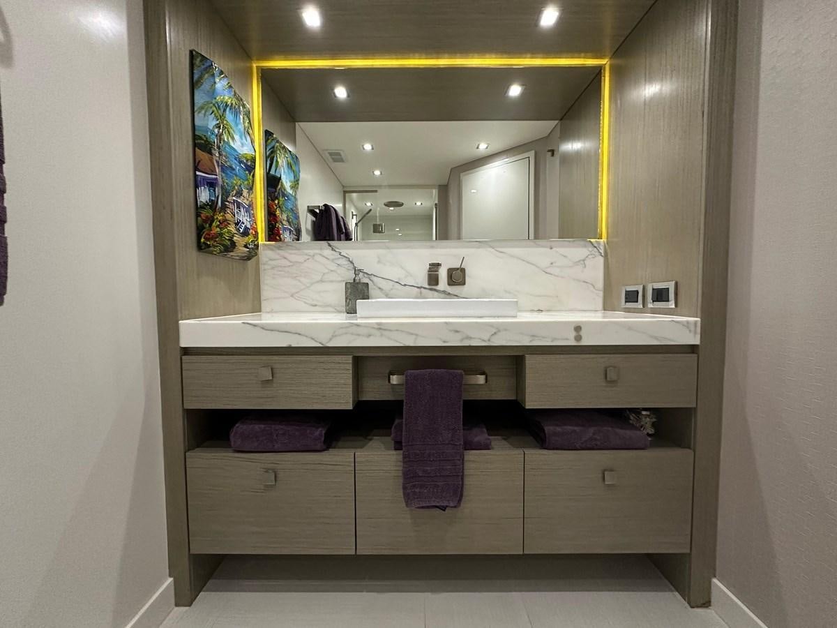 a bathroom with a large mirror aboard WATER RODEO Yacht for Sale