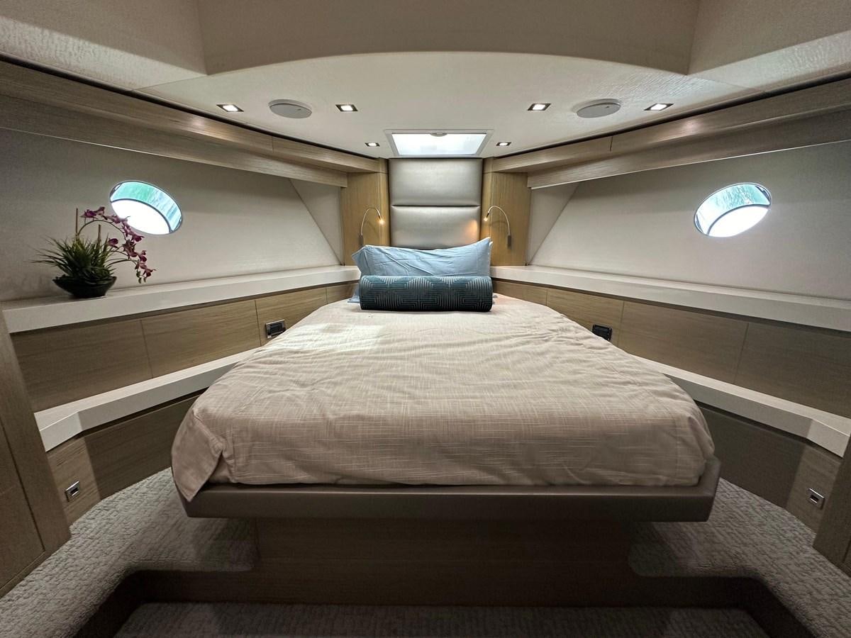 a bed in a room aboard WATER RODEO Yacht for Sale