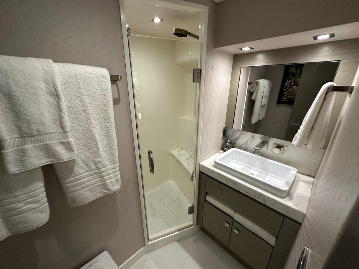 a bathroom with a sink and a mirror aboard WATER RODEO Yacht for Sale