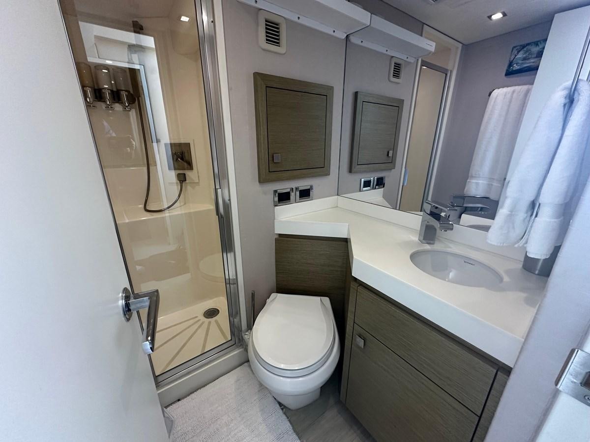 a bathroom with a toilet and sink aboard WATER RODEO Yacht for Sale