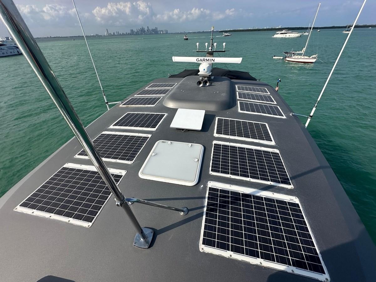 a deck with a boat and a laptop on it aboard WATER RODEO Yacht for Sale