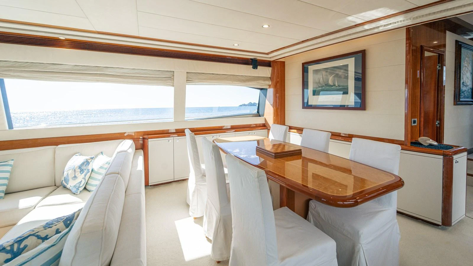 a room with a bed and a table aboard LADY HELENA Yacht for Sale