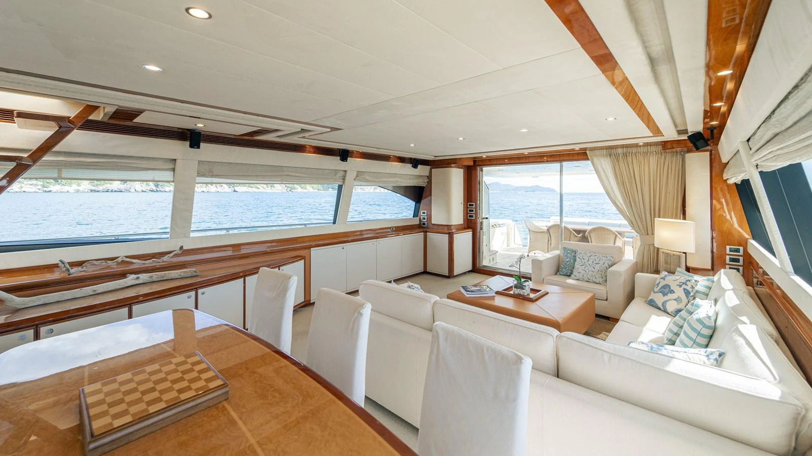 a large living room with a large window aboard LADY HELENA Yacht for Sale