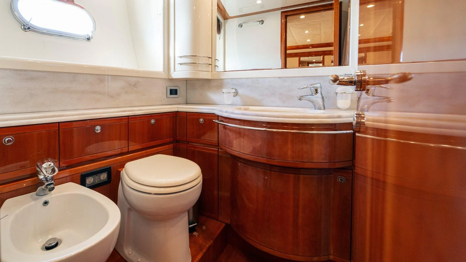 a bathroom with a toilet and sink aboard LADY HELENA Yacht for Sale