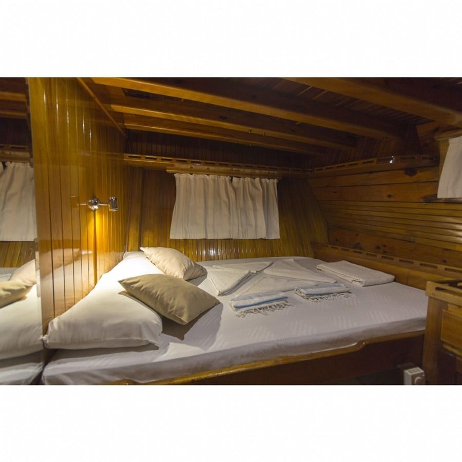 a bed with a canopy over it aboard NEMESIS Yacht for Sale