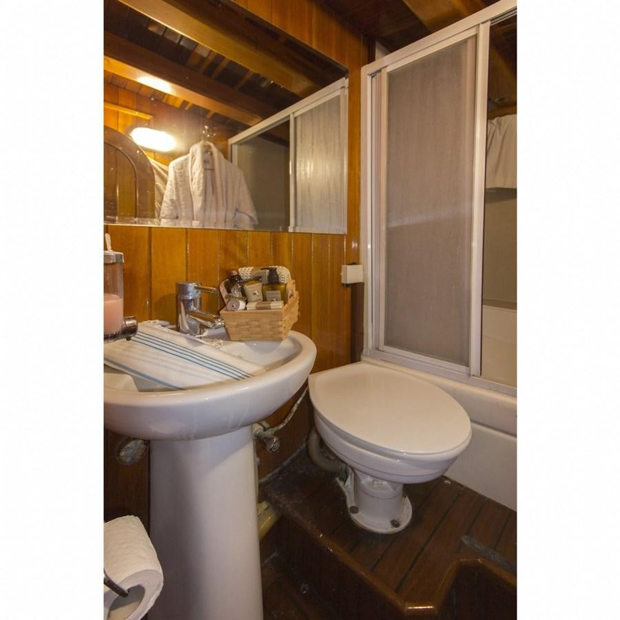 a bathroom with a sink and toilet aboard NEMESIS Yacht for Sale