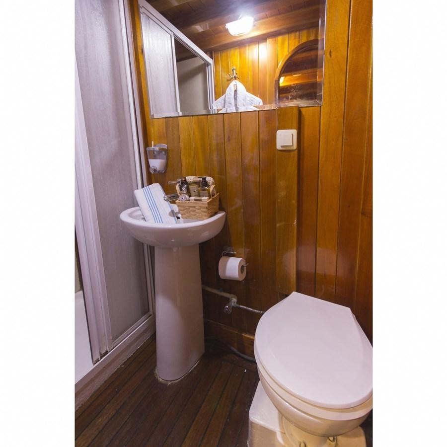 a bathroom with a sink and toilet aboard NEMESIS Yacht for Sale