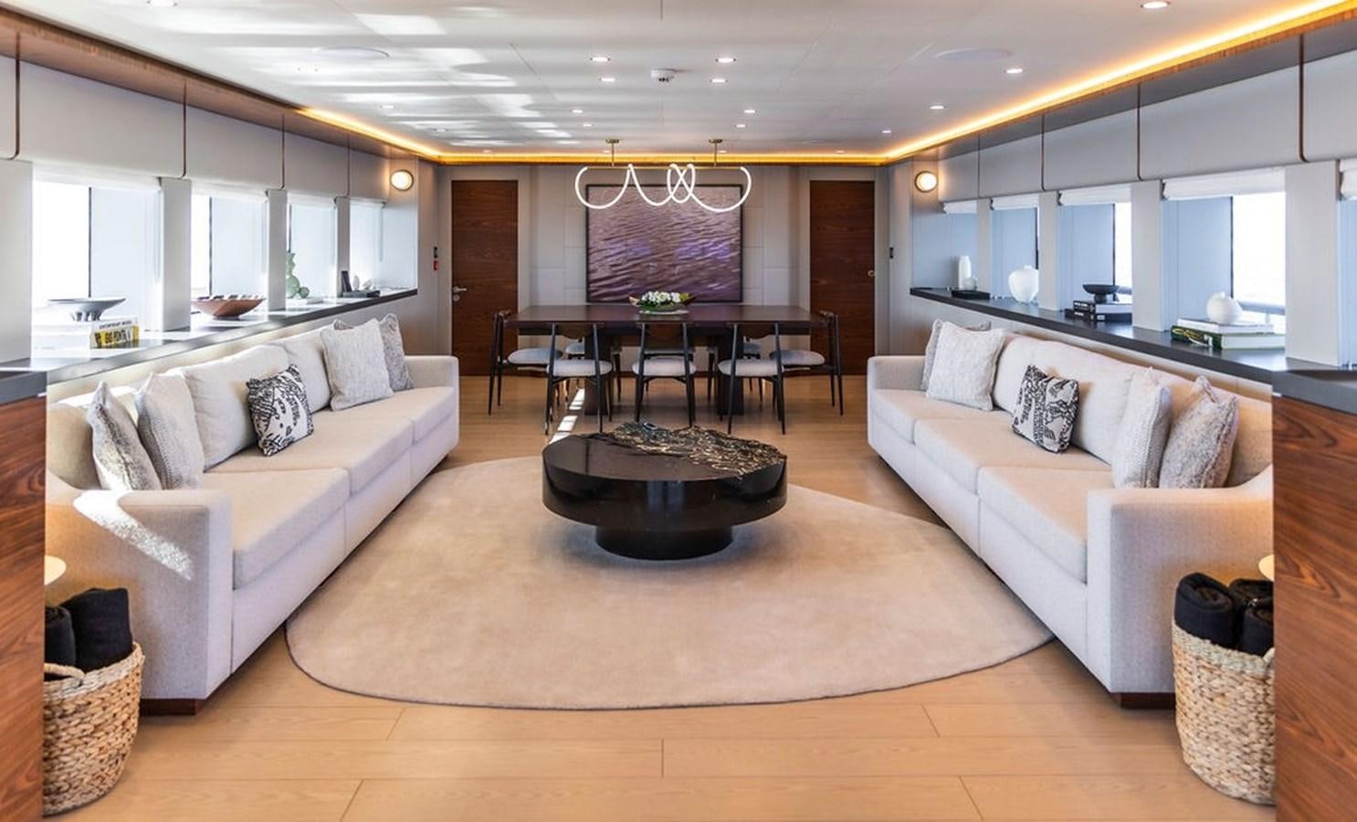 a living room with a couch and a table aboard INFINITY NINE Yacht for Sale