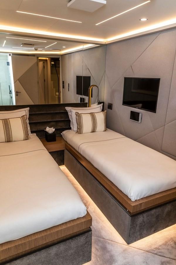 a room with two beds aboard INFINITY NINE Yacht for Sale