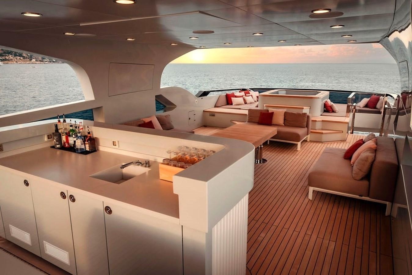 a room with a table and chairs aboard INFINITY NINE Yacht for Sale
