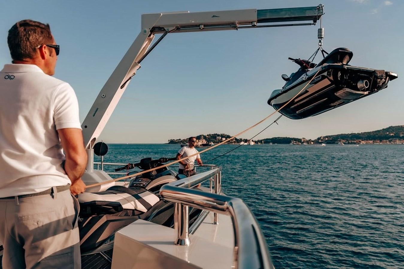 a man standing on a boat aboard INFINITY NINE Yacht for Sale