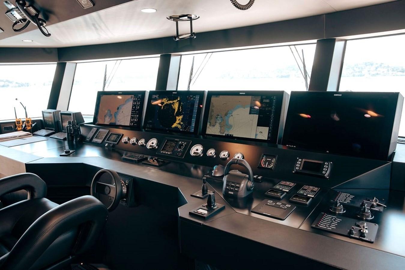 a control room with a large screen aboard INFINITY NINE Yacht for Sale