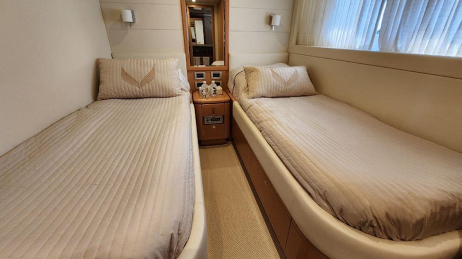 a bedroom with two beds aboard FERRETTI 870 Yacht for Sale