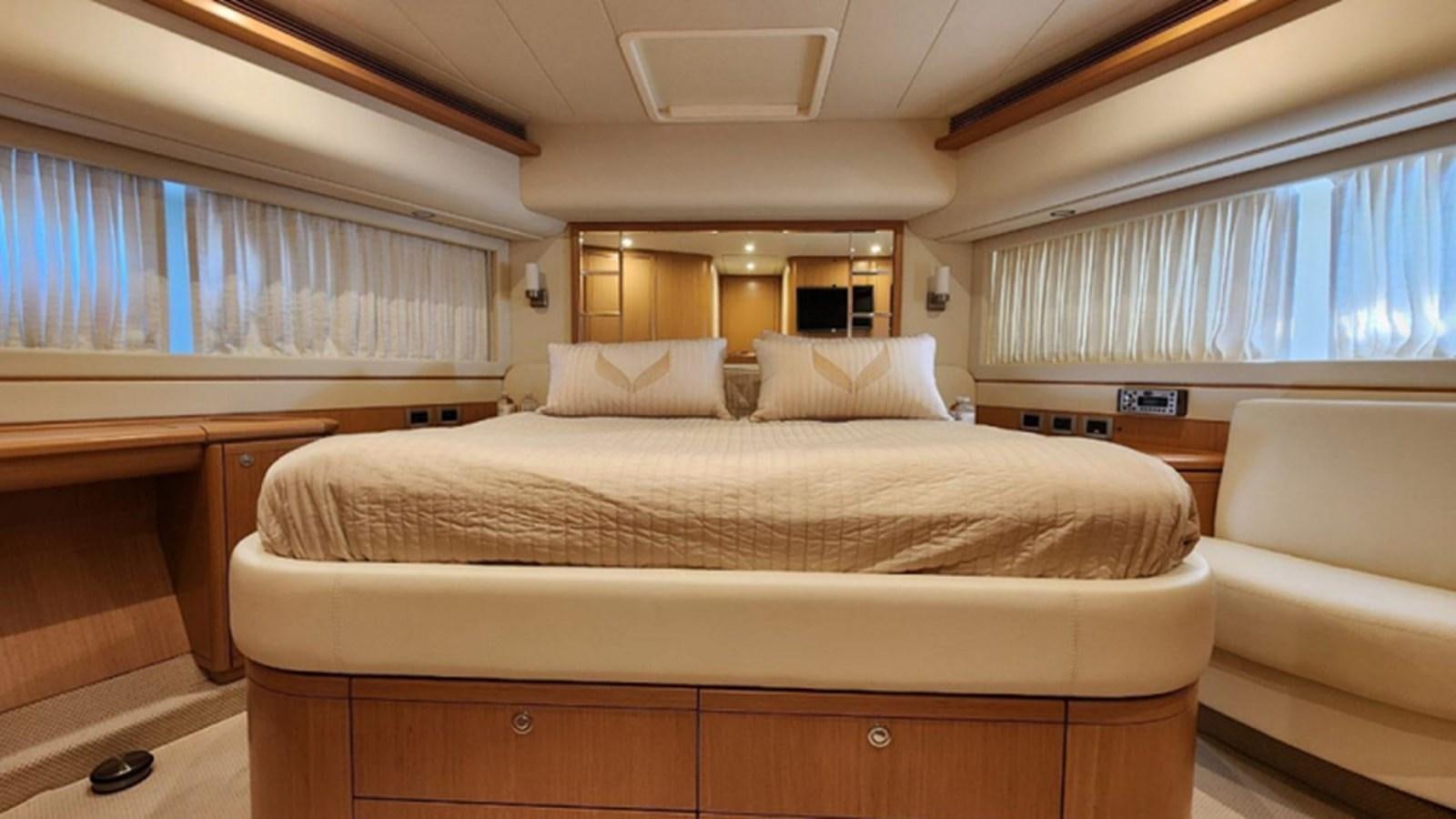a room with a bed and a couch aboard FERRETTI 870 Yacht for Sale