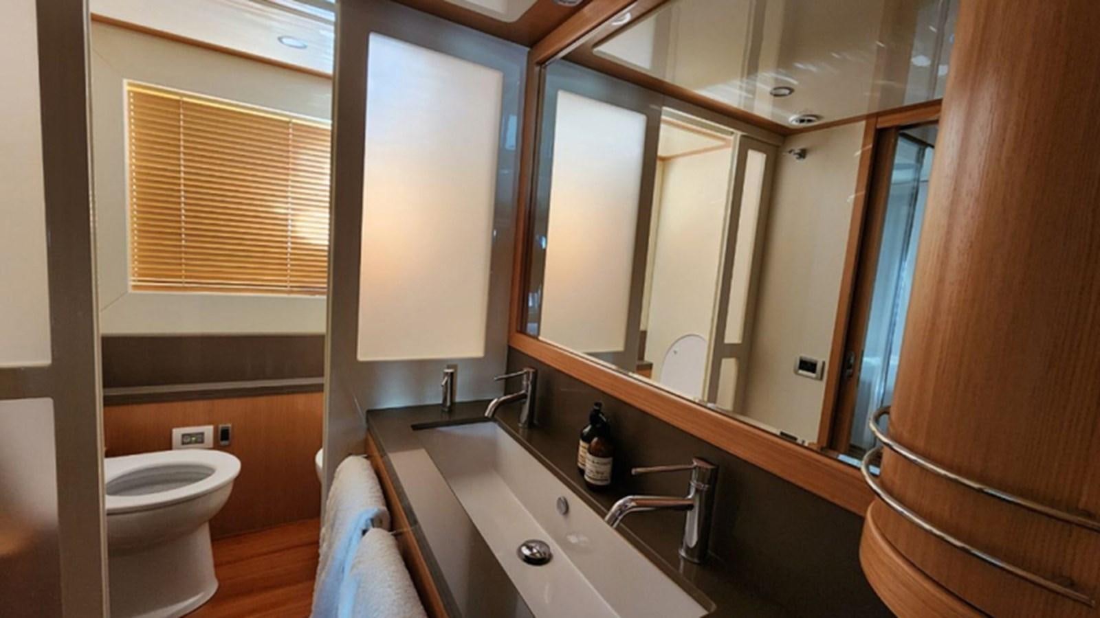 a bathroom with a sink and toilet aboard FERRETTI 870 Yacht for Sale