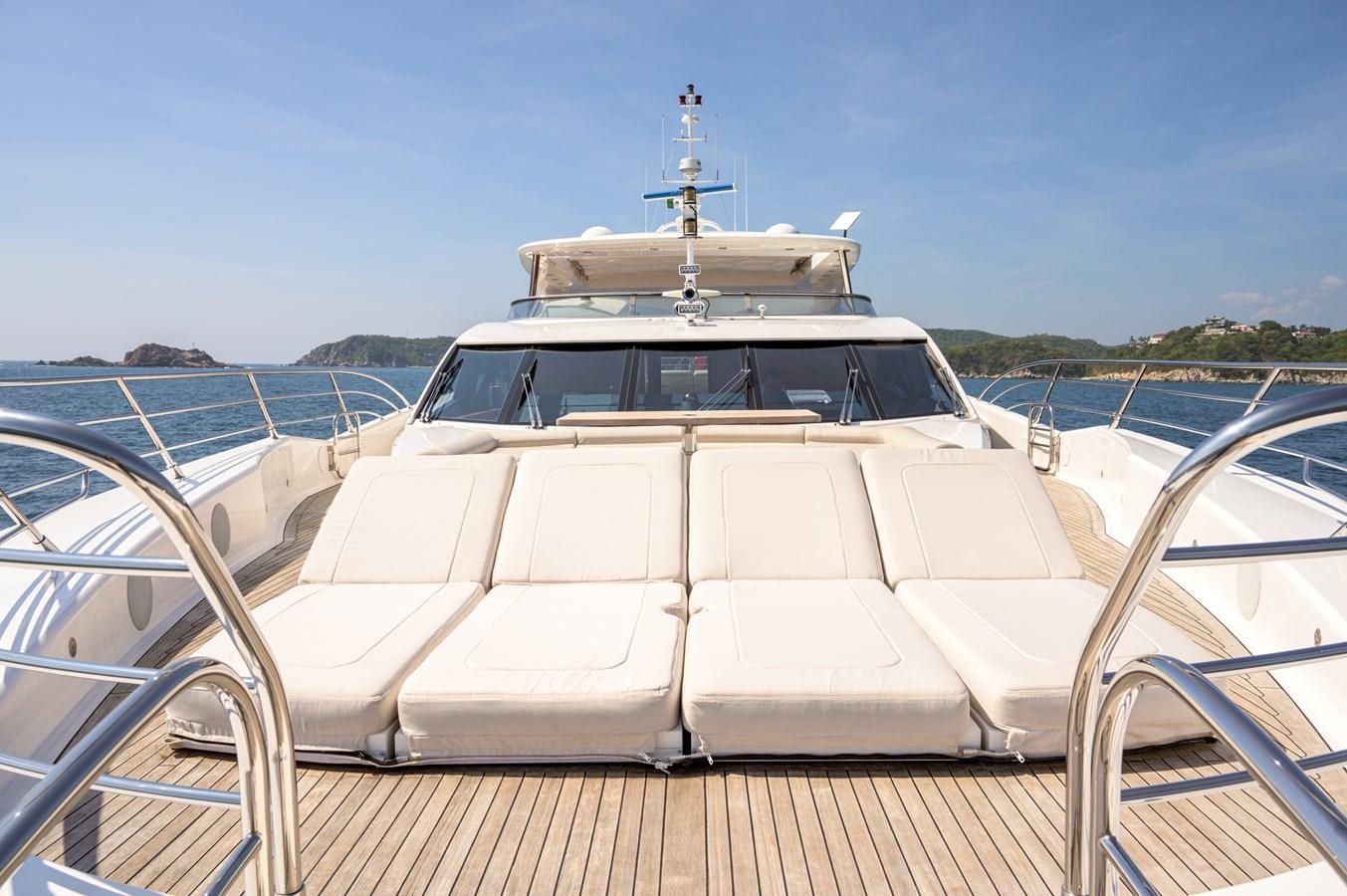 a white boat on a deck aboard M5 Yacht for Sale