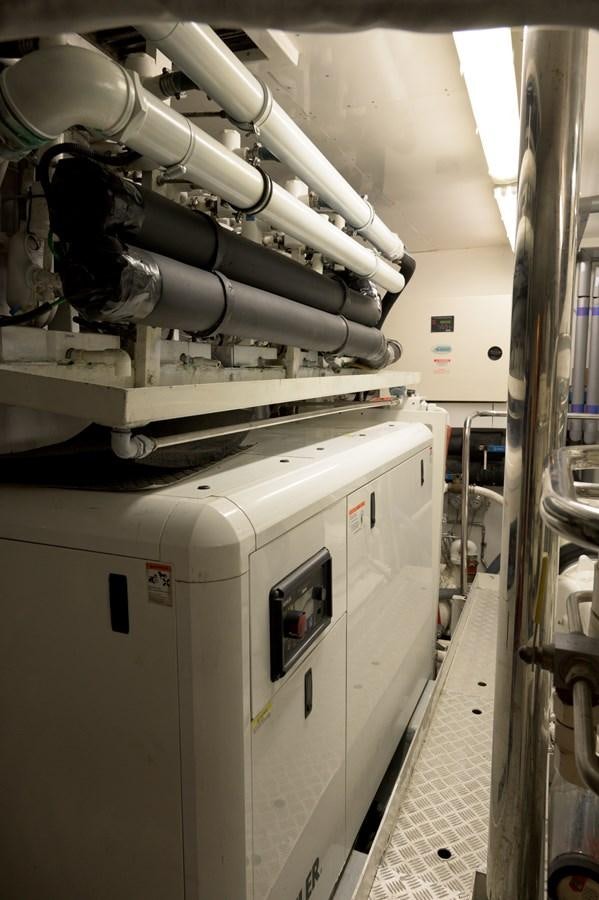 a machine in a room aboard M5 Yacht for Sale
