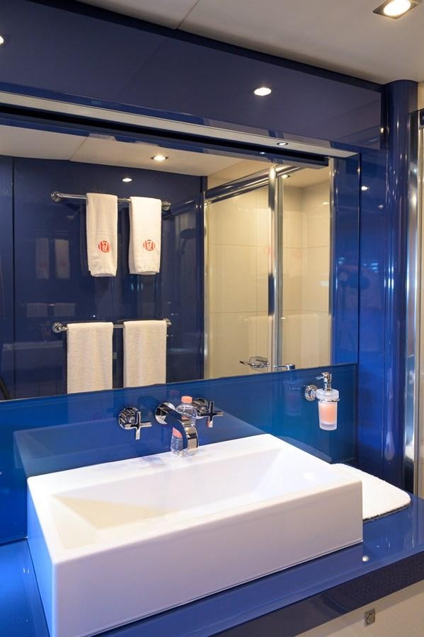 a bathroom with a large mirror aboard M5 Yacht for Sale