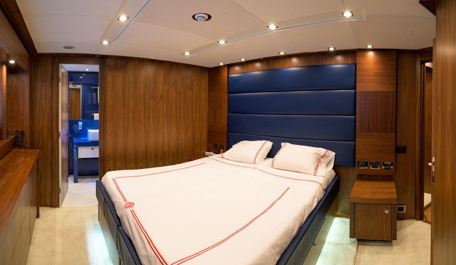 a bed in a room aboard M5 Yacht for Sale