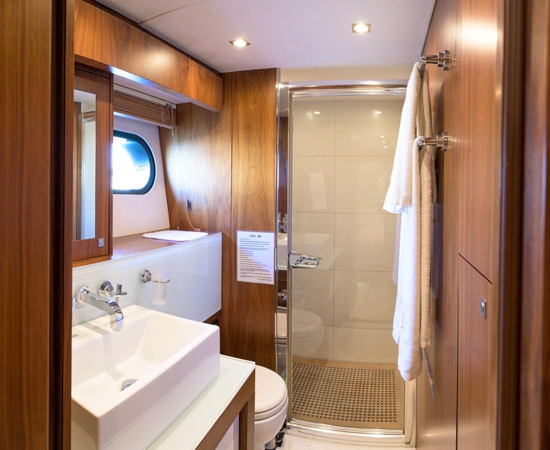 a bathroom with a shower sink and toilet aboard M5 Yacht for Sale