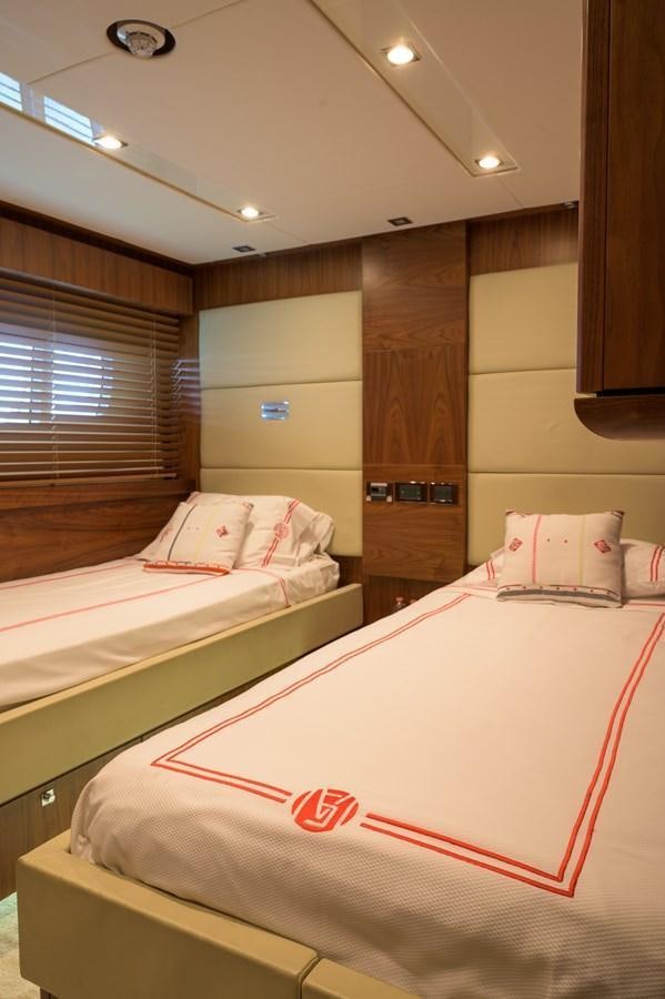 a room with two beds aboard M5 Yacht for Sale