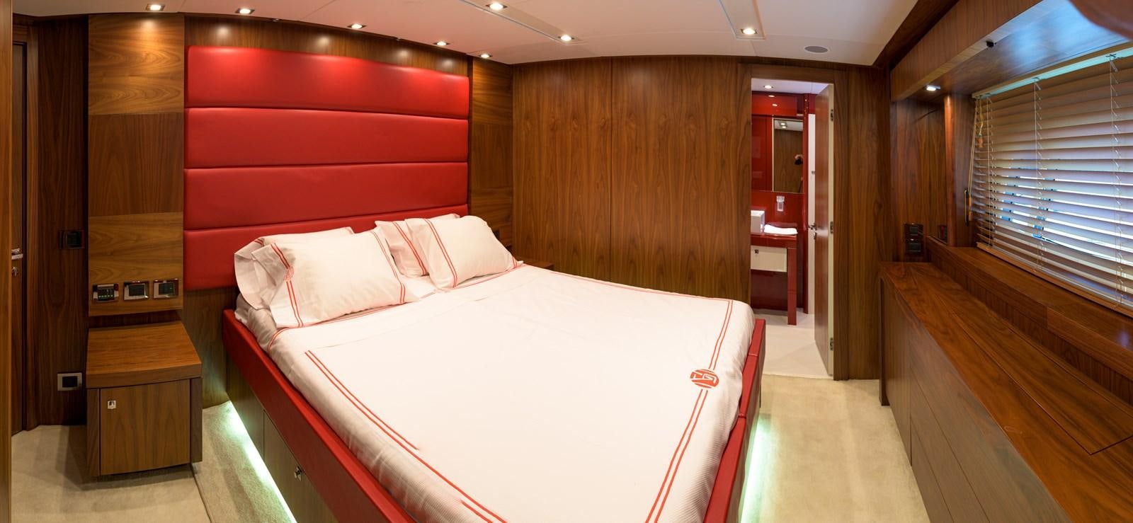 a bed in a room aboard M5 Yacht for Sale