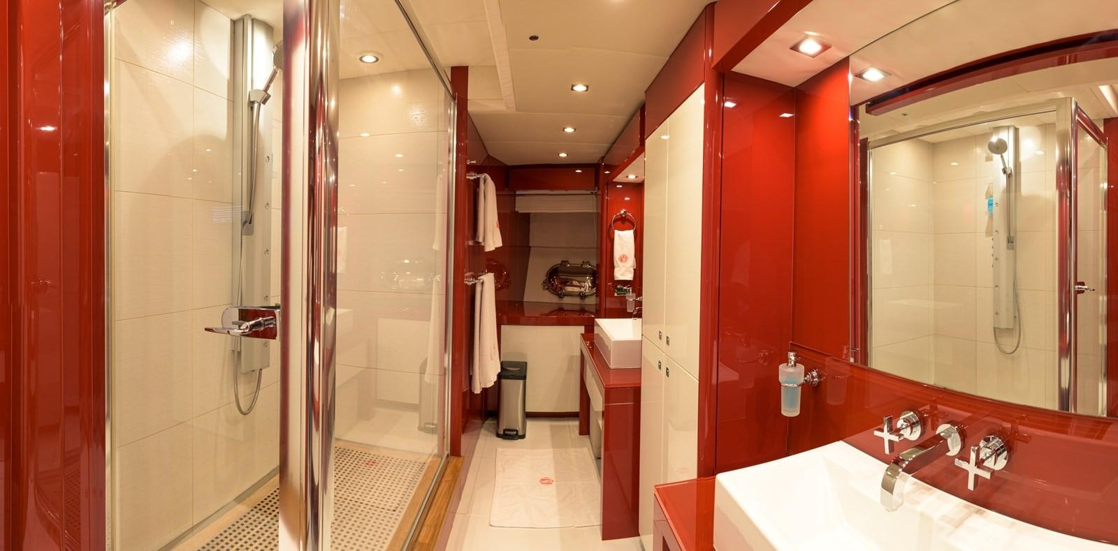 a bathroom with a large mirror aboard M5 Yacht for Sale