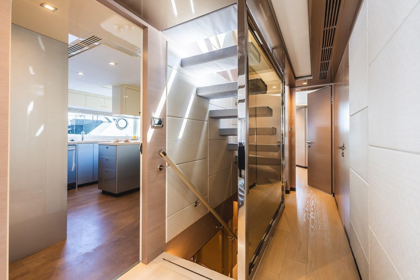 a hallway with a glass door aboard JUST A VACATION Yacht for Sale