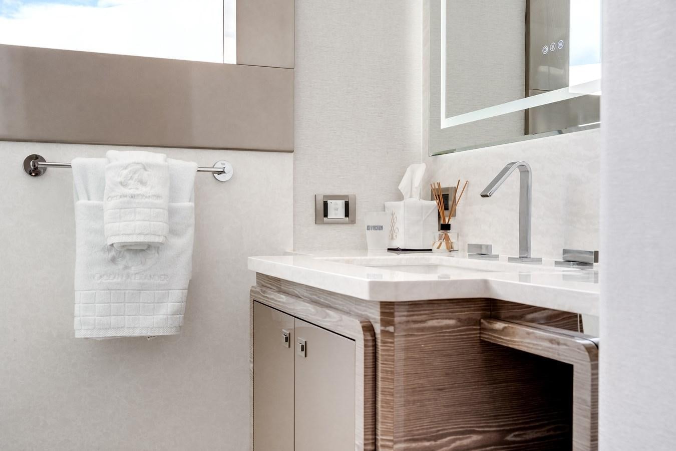 a bathroom with a sink and a mirror aboard JUST A VACATION Yacht for Sale