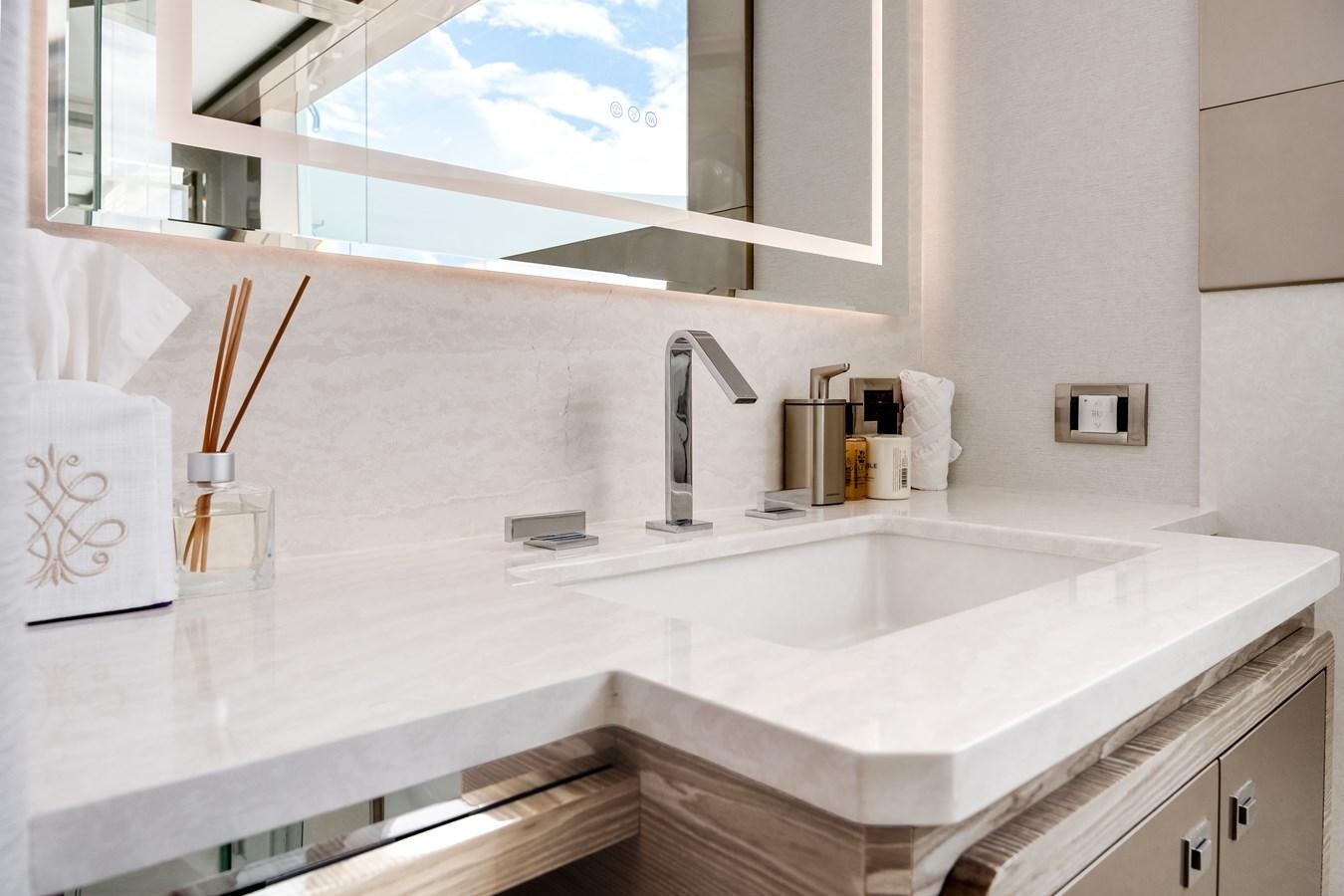 a bathroom with a large mirror aboard JUST A VACATION Yacht for Sale