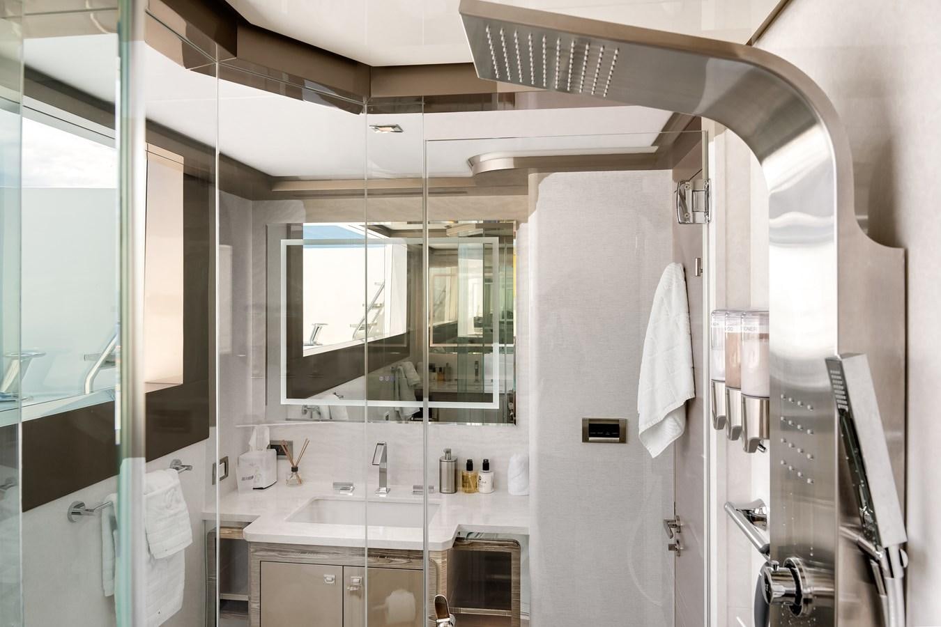 a bathroom with a large mirror aboard JUST A VACATION Yacht for Sale