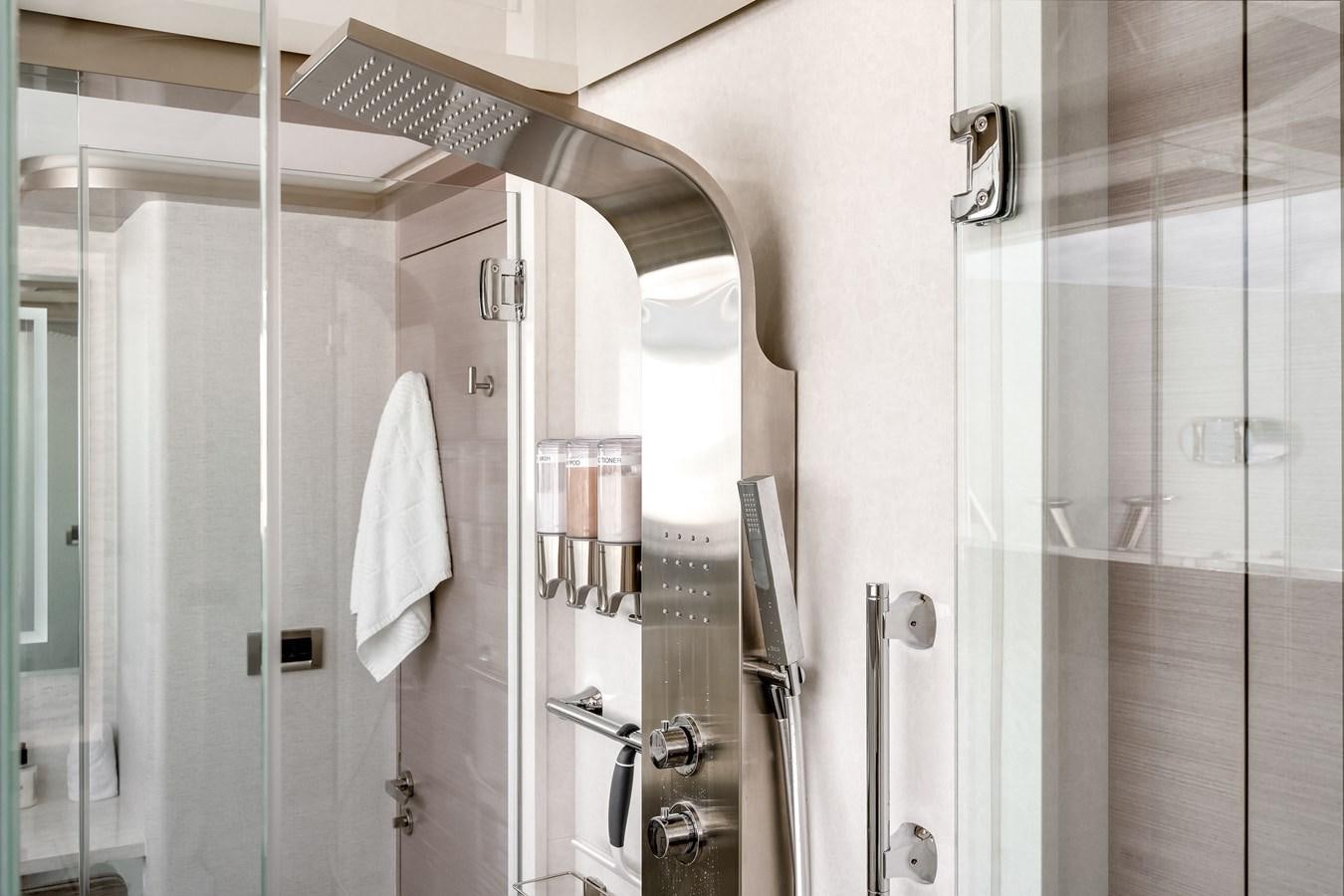 a bathroom with a shower unit aboard JUST A VACATION Yacht for Sale
