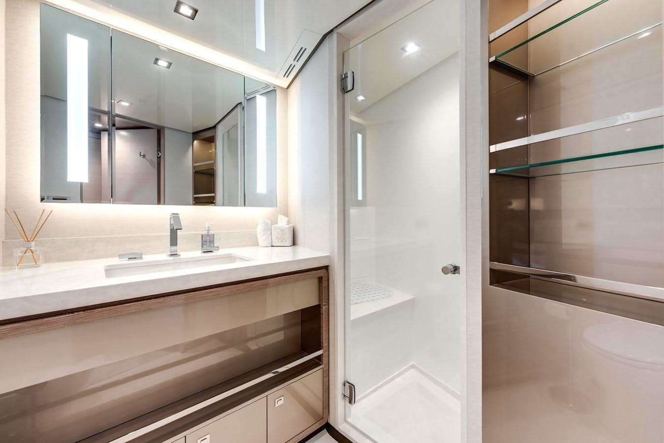 a bathroom with a large mirror aboard JUST A VACATION Yacht for Sale