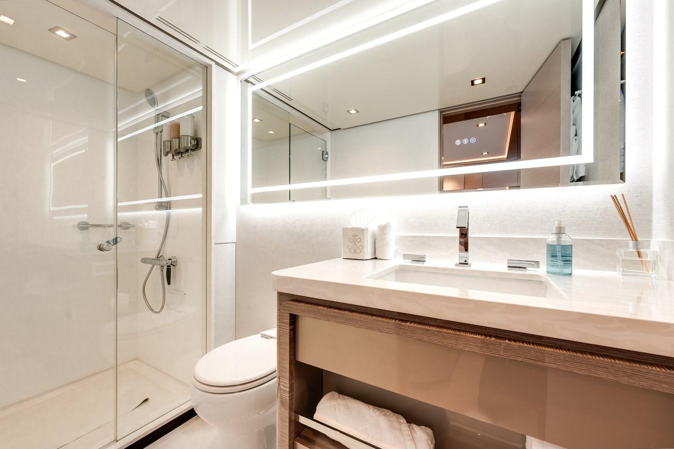 a bathroom with a glass shower aboard JUST A VACATION Yacht for Sale