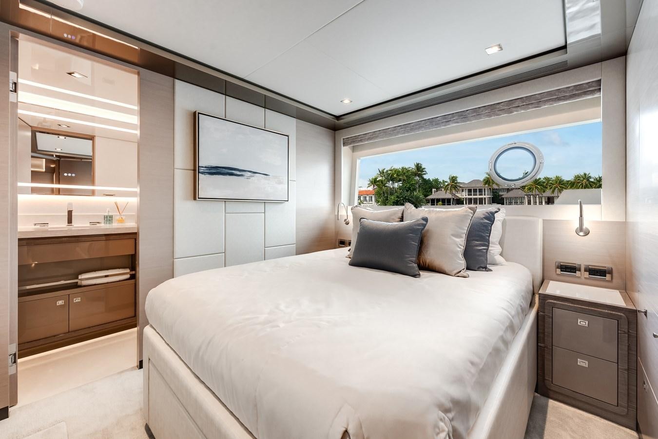 a bedroom with a large bed aboard JUST A VACATION Yacht for Sale