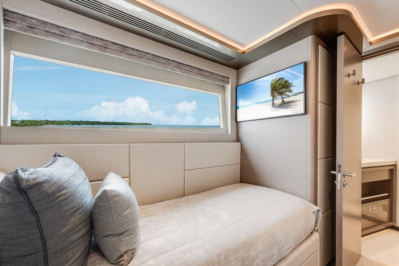 a room with a couch and a television aboard JUST A VACATION Yacht for Sale