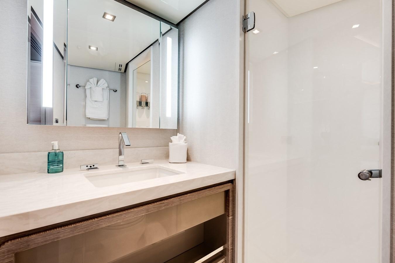 a bathroom with a large mirror aboard JUST A VACATION Yacht for Sale