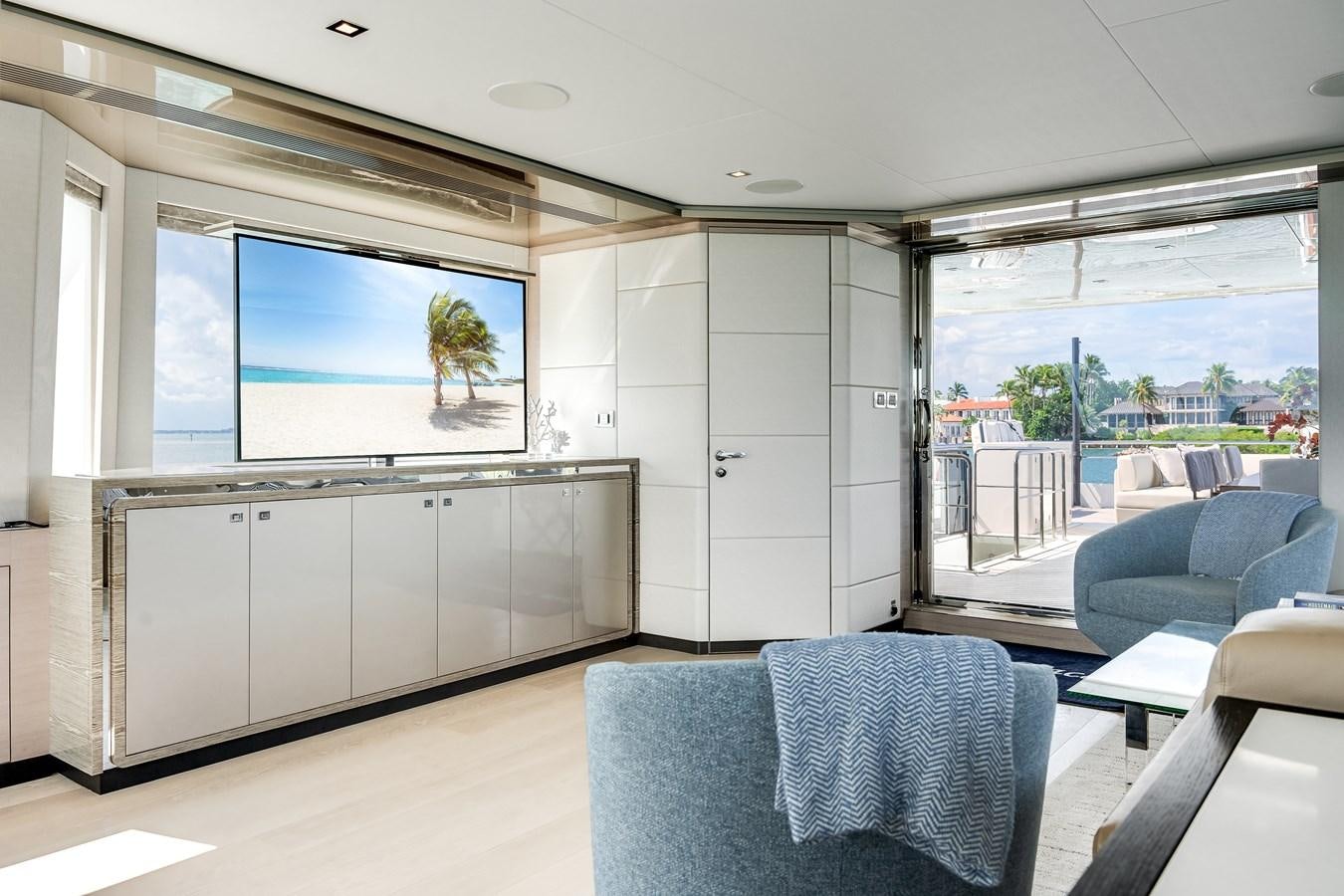a room with a large window and a view of the city aboard JUST A VACATION Yacht for Sale