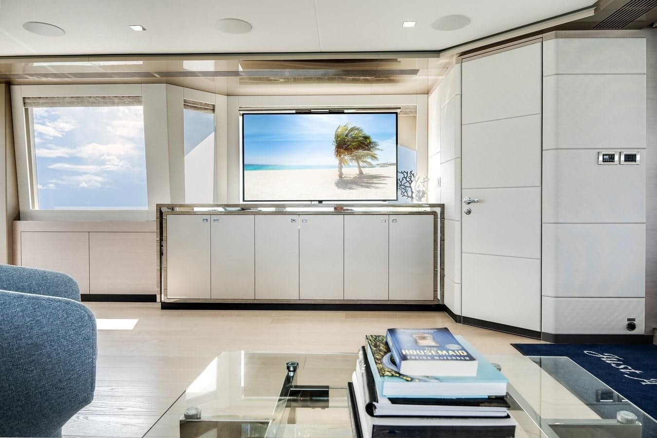 a room with a large window aboard JUST A VACATION Yacht for Sale