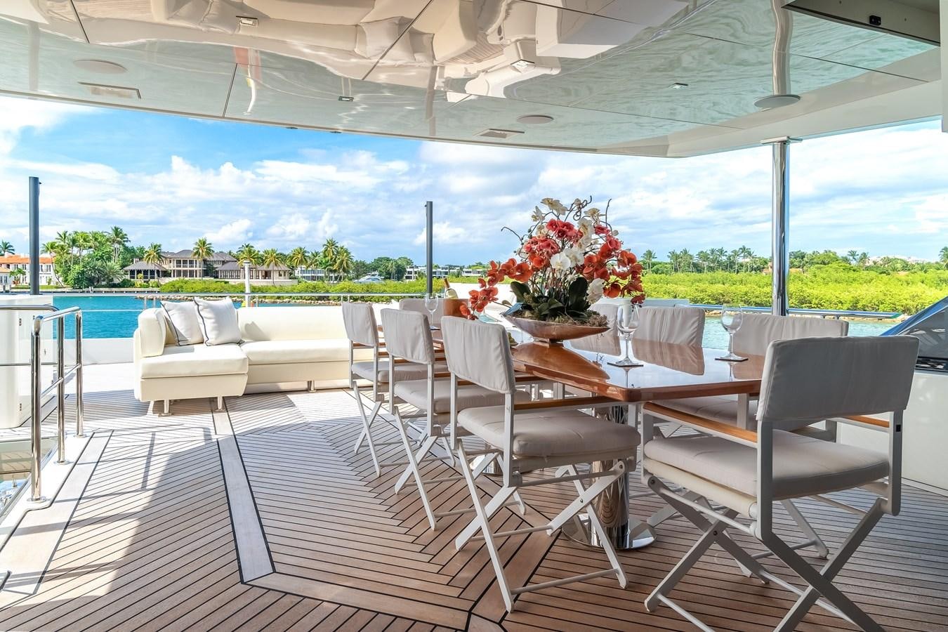 a patio with chairs and tables aboard JUST A VACATION Yacht for Sale