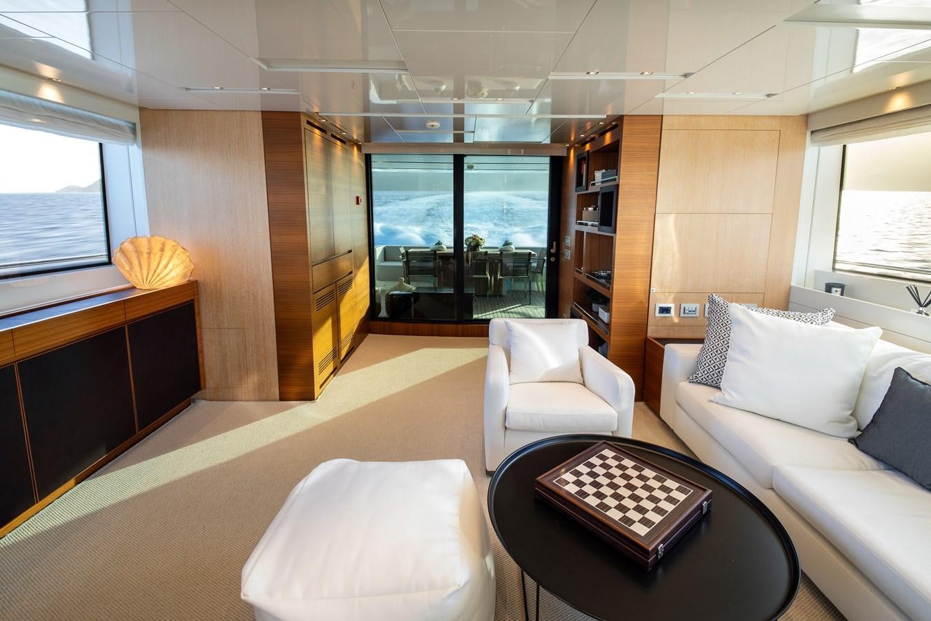 a room with a couch and a table aboard CYBELE Yacht for Sale