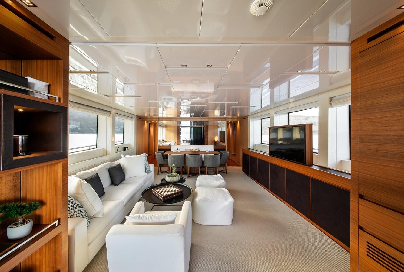 a living room with a couch and a television aboard CYBELE Yacht for Sale