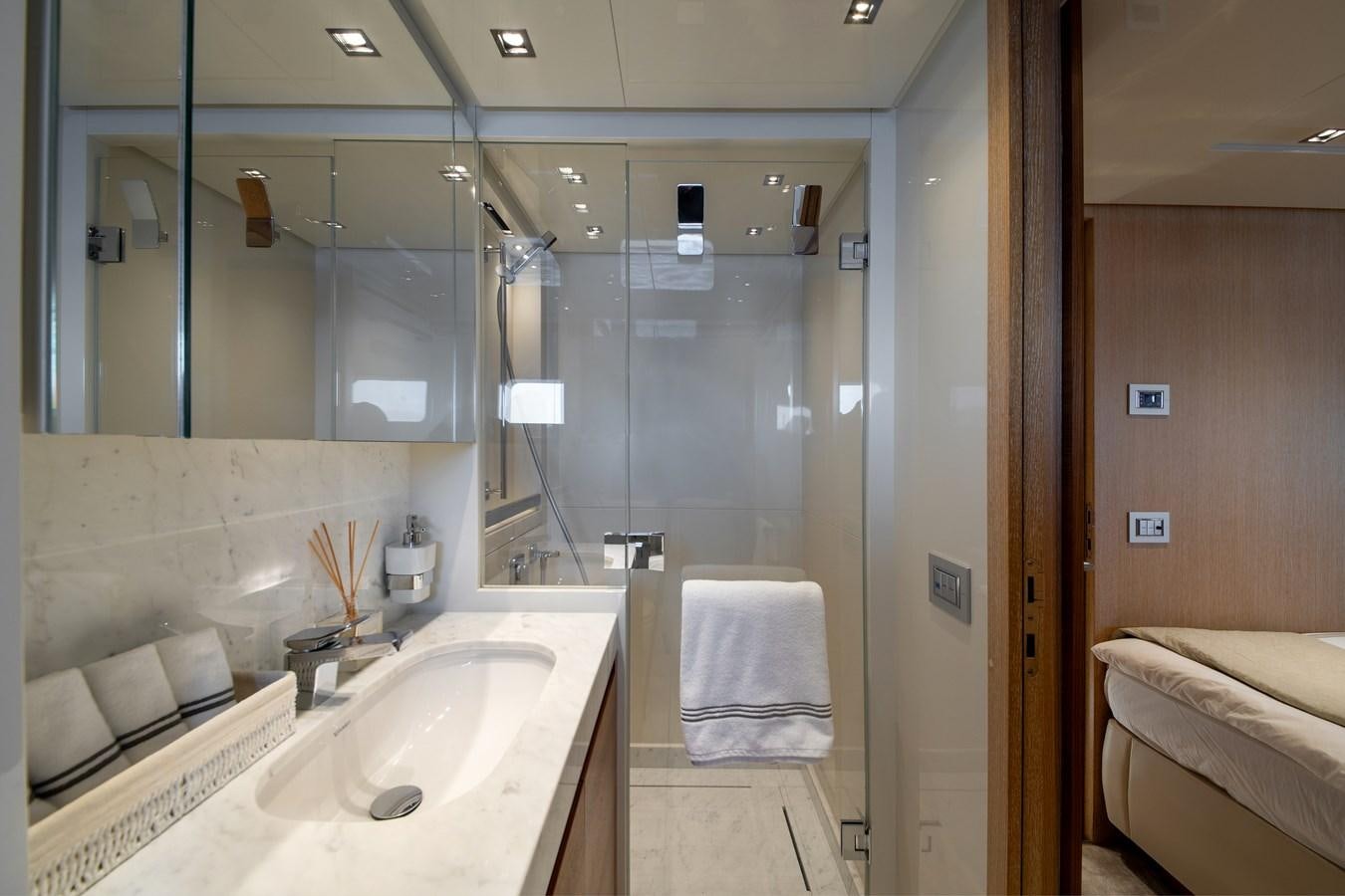 a bathroom with a glass shower aboard CYBELE Yacht for Sale