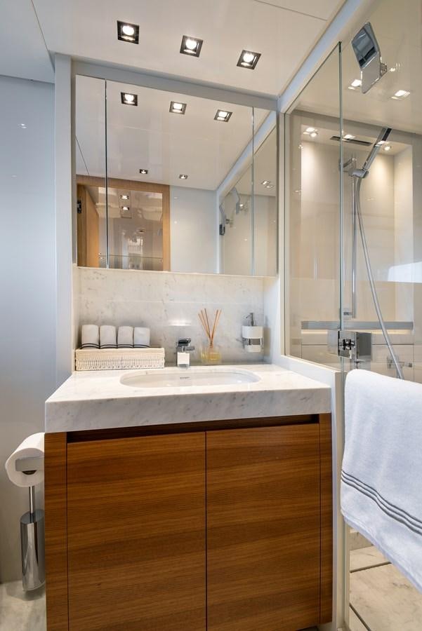 a bathroom with a glass shower aboard CYBELE Yacht for Sale