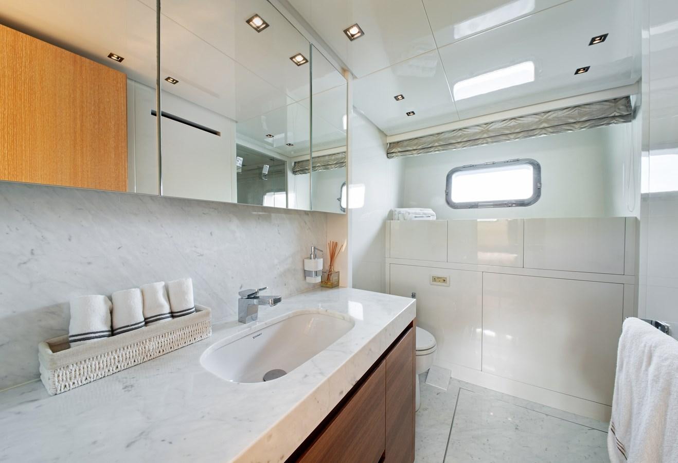 a bathroom with a sink and a mirror aboard CYBELE Yacht for Sale