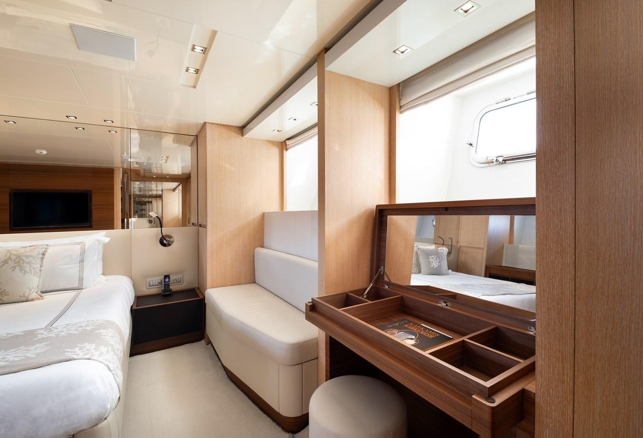 a bathroom with a sink and a bed aboard CYBELE Yacht for Sale